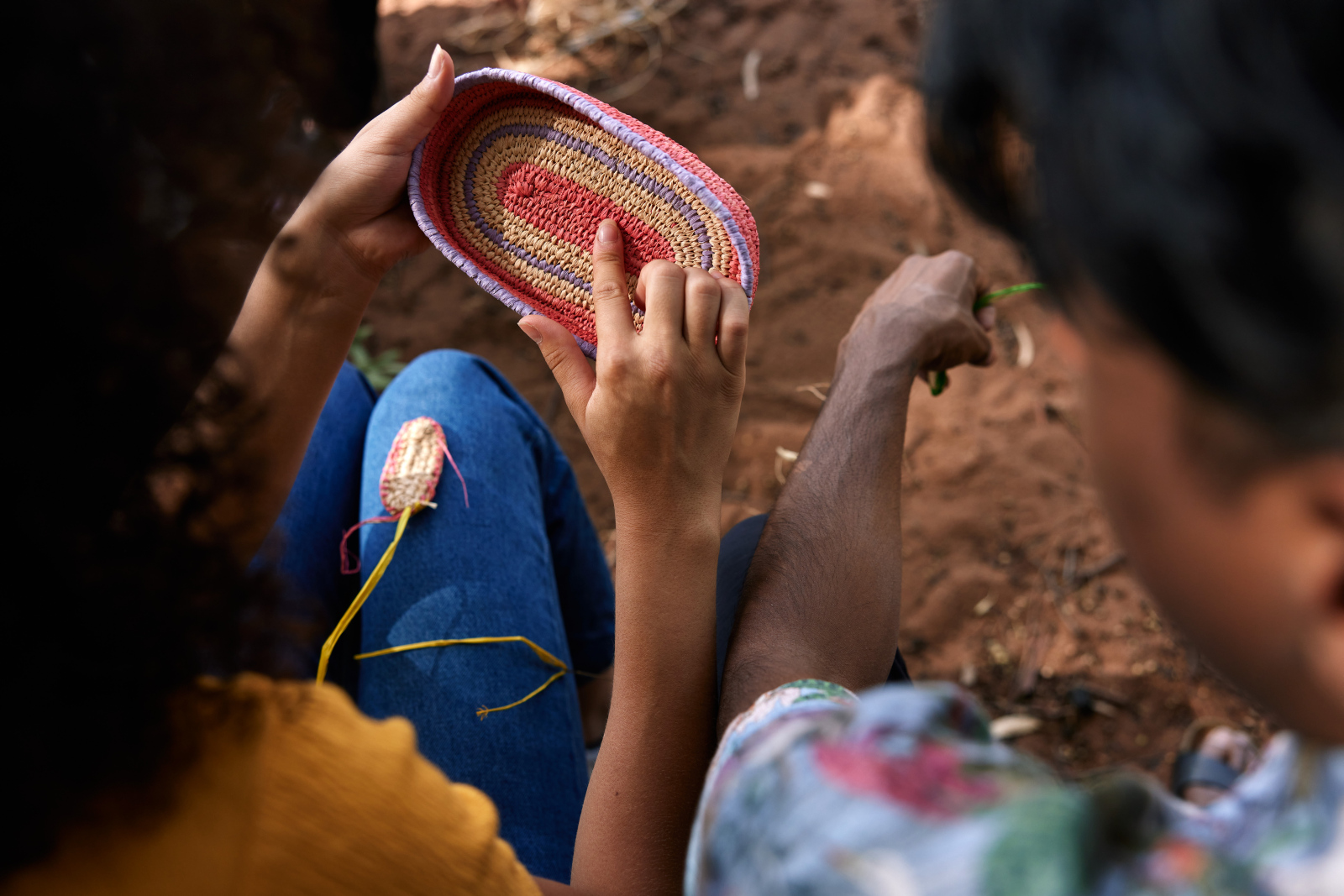 Delegates weaving a basket on Country